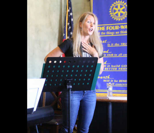 Larsen sings along with special guests