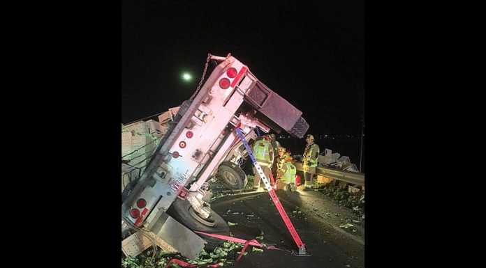 Tractor trailer crash slows down 101